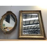 A decorative, oval, gilded mirror, plus 1 other.