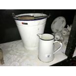 A vintage enamel slop bucket and a jug