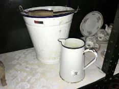 A vintage enamel slop bucket and a jug