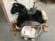 A rocking horse & dolls pram