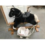 A rocking horse & dolls pram