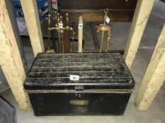 A metal box and contents including brass fireside companion set