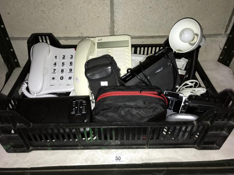 A box of telephones and radios etc.