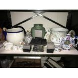 A shelf of pottery and porcelain including Coalport collectors plates