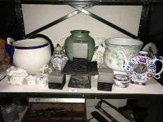 A shelf of pottery and porcelain including Coalport collectors plates