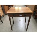 An oak side table with dummy drawer