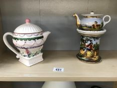 A painted porcelain teapot on a stand and a collectors teapot.