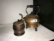 A vintage copper electric kettle on ball and claw feet and an oak tea caddy