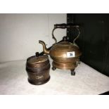 A vintage copper electric kettle on ball and claw feet and an oak tea caddy