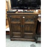 A dark wood tv cabinet.
