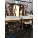 A pair of Edwardian oak hall chairs