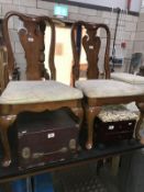 A pair of Edwardian oak hall chairs