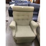 A green fabric armchair