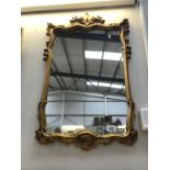 An Ormalu gilt framed mirror.
