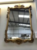 An Ormalu gilt framed mirror.