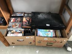 A large quantity of videos (2 boxes) and a dvd/video recorder.