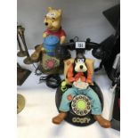 Two Disney Figure Telephones, Winne the Pooh And Goofy.