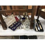 A quantity of silver plate including cruet set, cutlery & napkin rings etc.