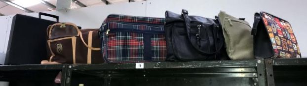 A briefcase and 5 other bags