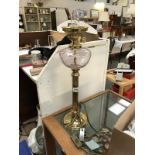 A brass electric oil lamp