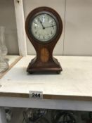 An Edwardian inlaid mahogany balloon clock