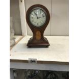 An Edwardian inlaid mahogany balloon clock