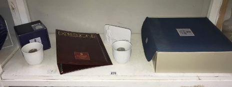 A boxed Lladro gift set and a boxed Lladro ship candle holder