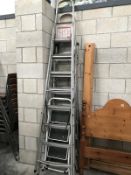 3 sets of large metal ladders and a small set of steps