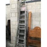 3 sets of large metal ladders and a small set of steps