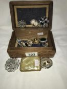 A jewellery box and a quantity of brooches etc.