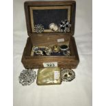 A jewellery box and a quantity of brooches etc.