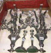 A pair of silver plate candlestick and a pair of metal pheasants