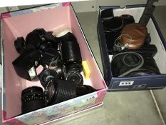 A quantity of camera lenses etc.