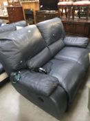 A blue electric reclining 2 seater sofa
