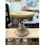 A small circular oak coffee table