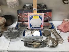 A quantity of boxed silver plated place mats & coasters etc.