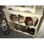 A set of painted wooden book shelves