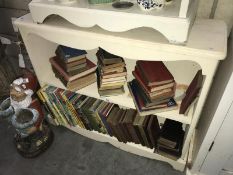 A set of painted wooden book shelves