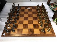 A chess board with good set of chess pieces.