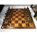 A chess board with good set of chess pieces.