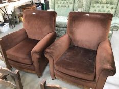 A pair of brown suede effect armchairs