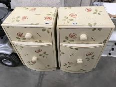 A pair of painted bedside chests