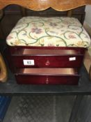 A dark wood stained 2 drawer tapestry covered work stool