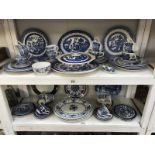 2 shelves of blue and white china