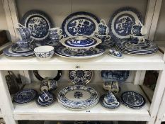 2 shelves of blue and white china