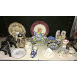 A shelf of miscellaneous pottery and porcelain