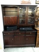 A dark wood stained sideboard wall unit