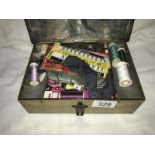 An old tin of sewing items