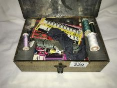 An old tin of sewing items