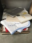 A box of linen etc. Including table cloths & pillow cases etc.